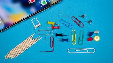 how to open iphone sim card slot with safety pin